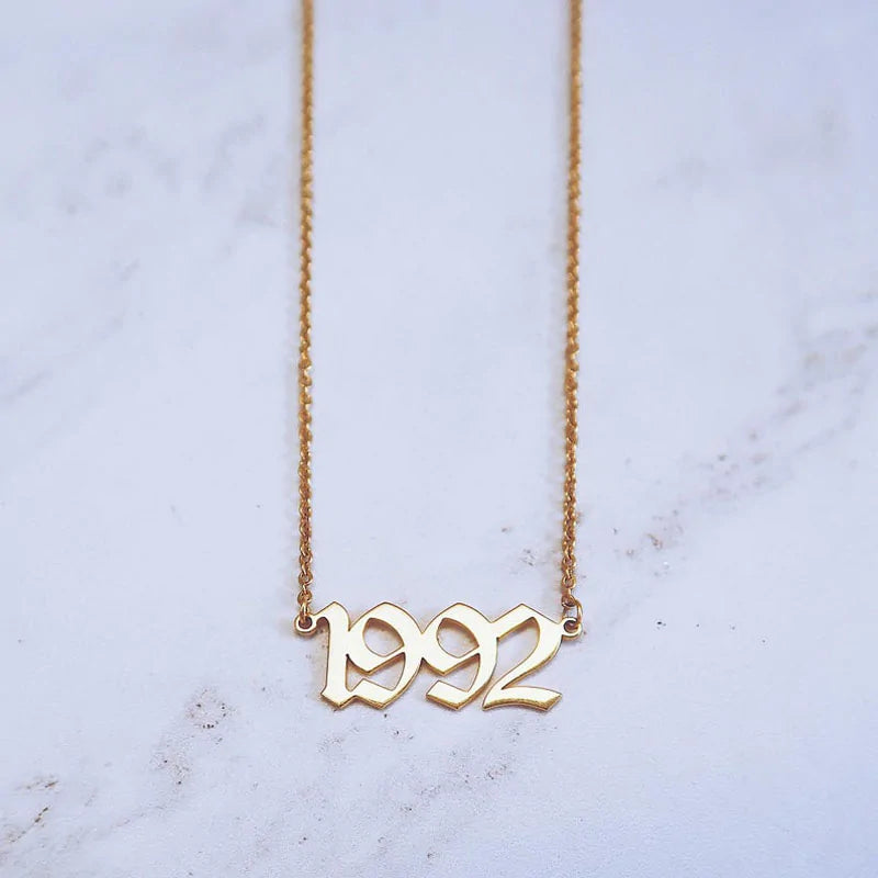 Introducing our 1987-2001 Birth Year Personalized Necklace, a timeless piece crafted for elegance and individuality.

Made from durable Stainless Steel, this necklace is designed to last and retain its beauty for years to come. The pendant features Old English Number Dates, adding a touch of vintage charm to any outfit. Whether it’s a birthday, graduation, or special occasion, this necklace is the perfect gift choice.

