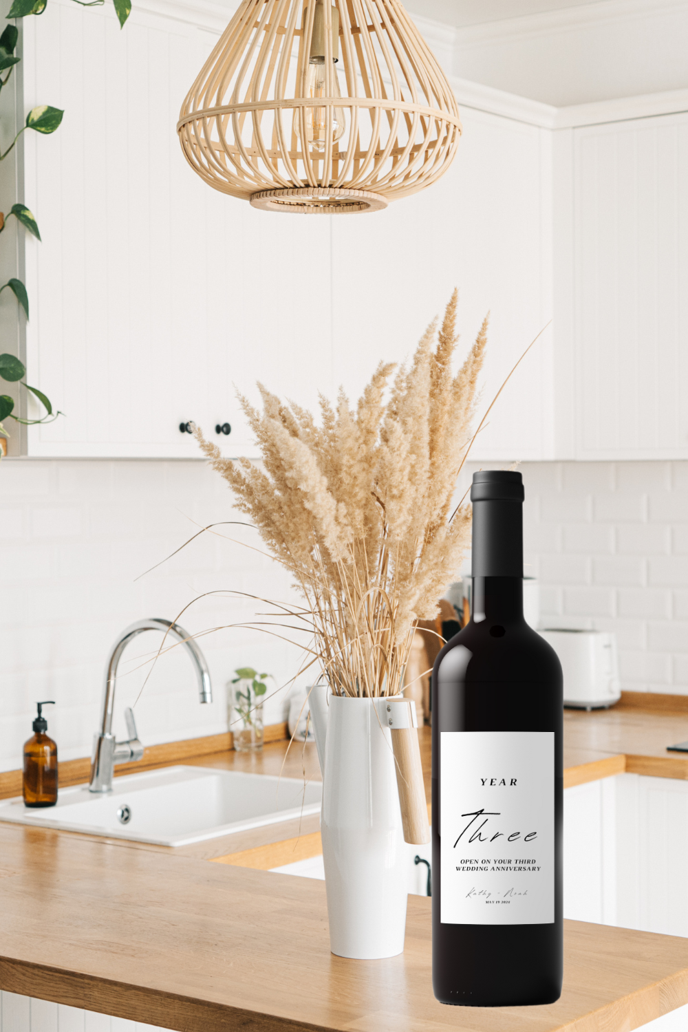 Image of the wine bottle sitting on a kitchen counter to see what it will look like with the wine label once printed and added to the wine bottle.