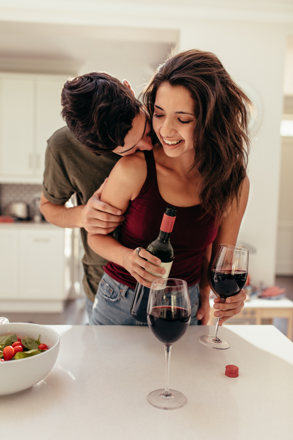 A couple celebrating one of the years with the wine for a date night and anniversary.