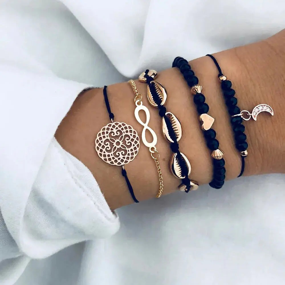 "Elevate Your Style with Our Bohemian Shell Moon Charm Bracelet Set!

Indulge in the allure of Bohemian elegance with our captivating Shell Moon Charm Bracelet Set. Crafted to complement your unique style, each piece exudes a sense of wanderlust and free-spirited charm, elevating every outfit effortlessly.

Embrace the enchanting beauty of the moon and the whimsy of shells with this 5-piece collection. 